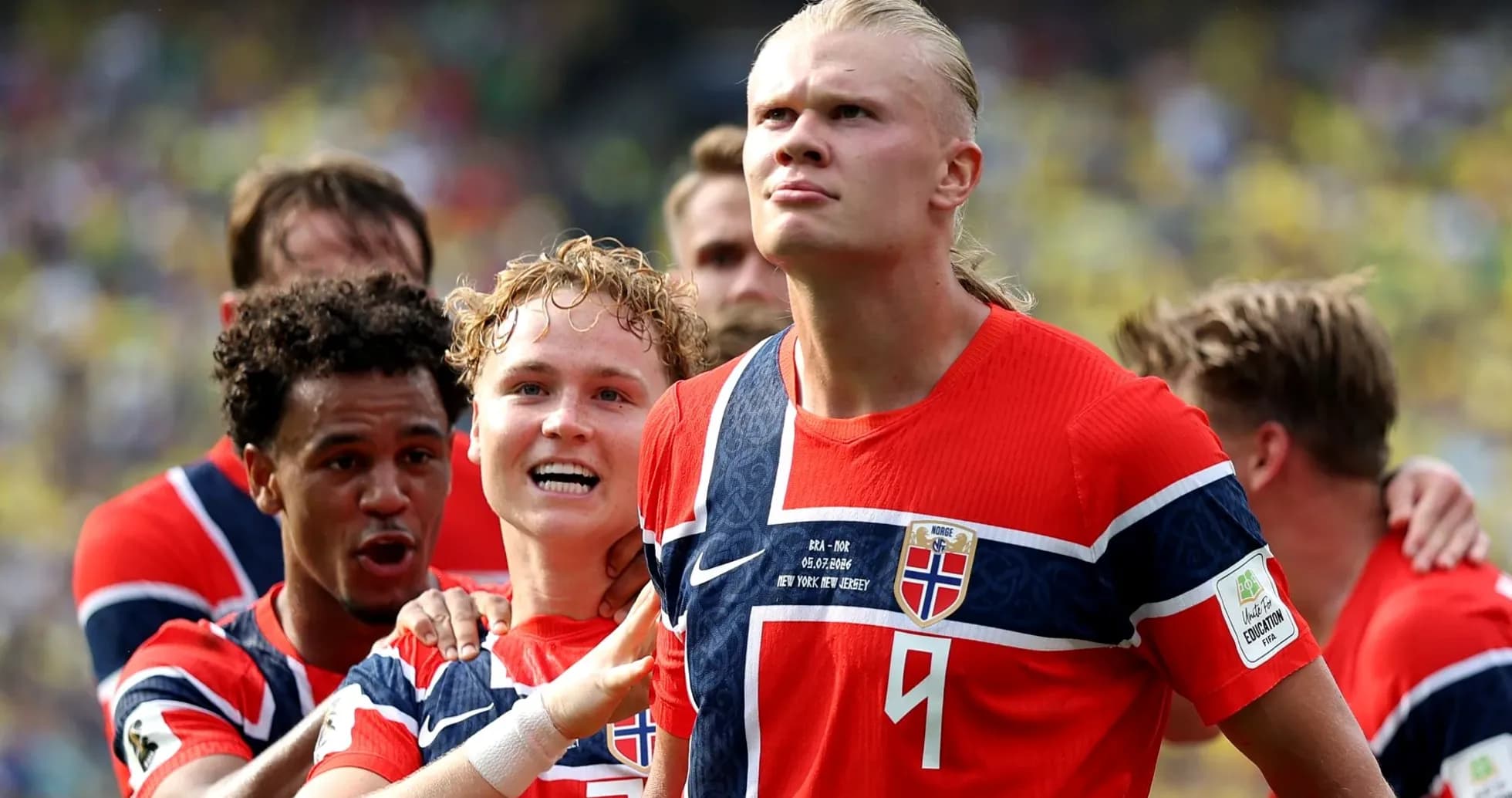 Norwegian players celebrating a goal on the field