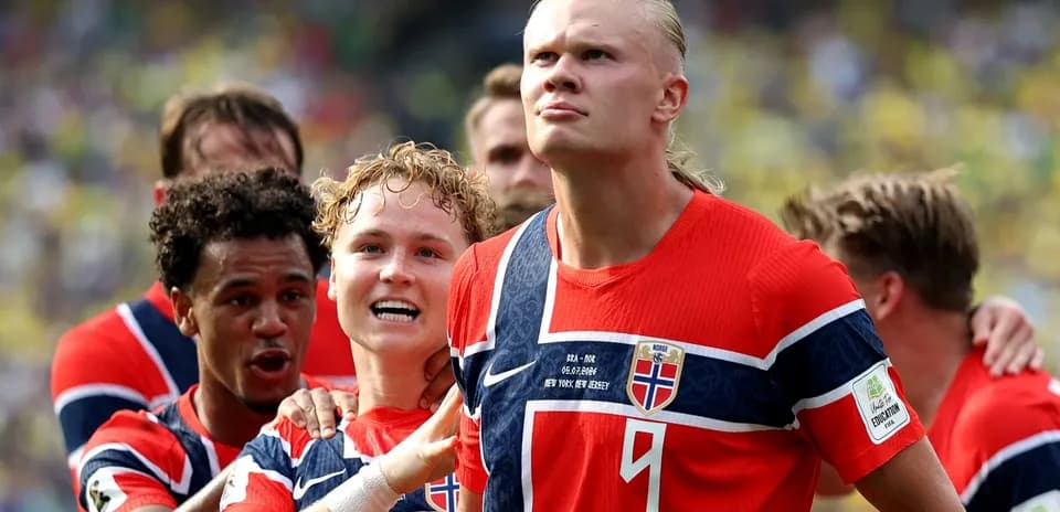 Norwegian players celebrating a goal on the field