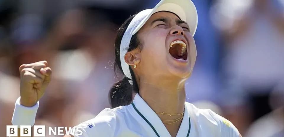 Tennis player celebrating victory with a fist pump