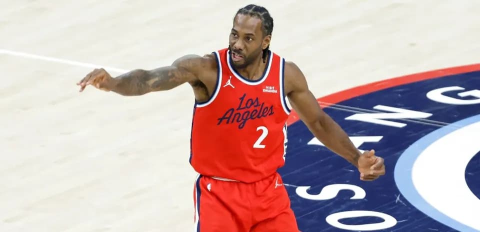 Basketball player signaling during game on court