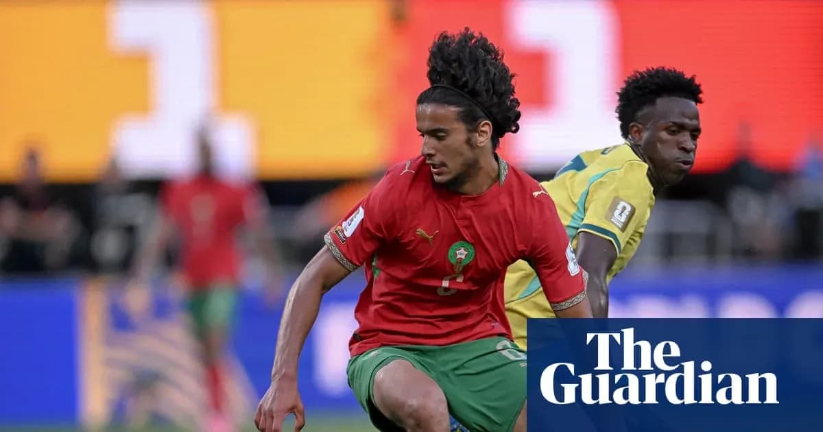 Morocco player dribbling past opponent during match