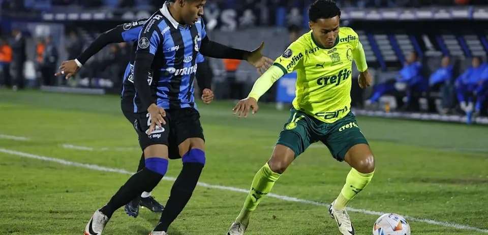 Two players contesting for the ball on the field