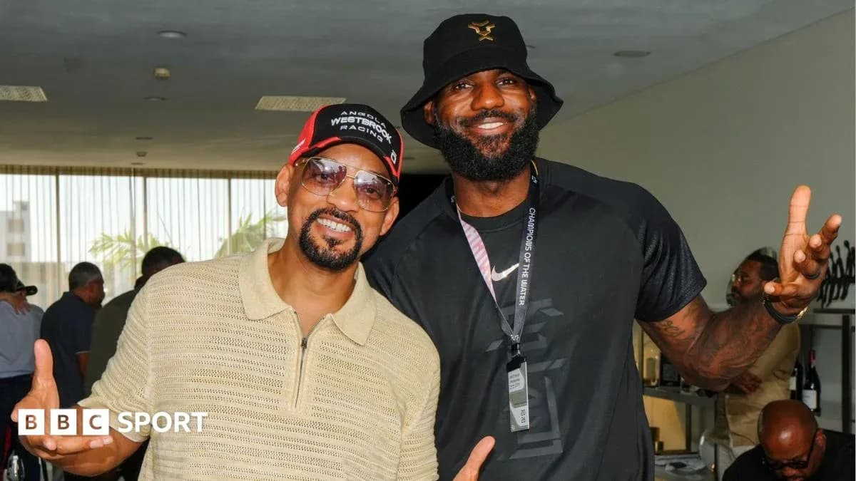 LeBron James and Will Smith posing together indoors