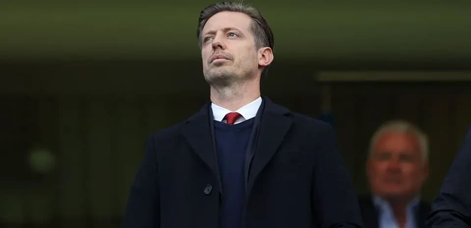 Man observing from stands during a match