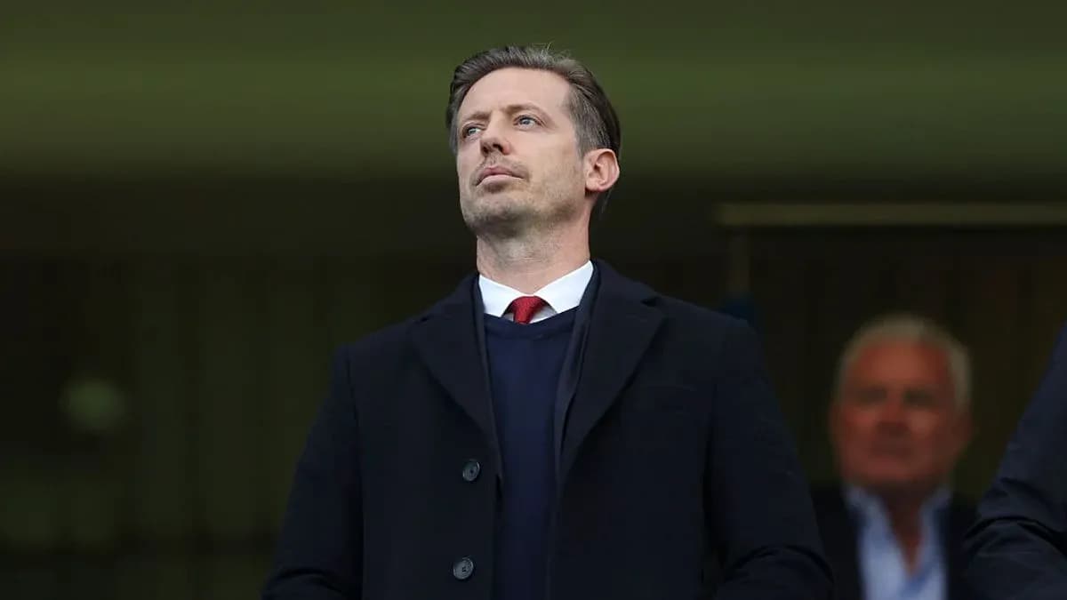 Man observing from stands during a match