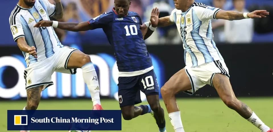 Three players battling for the ball during match