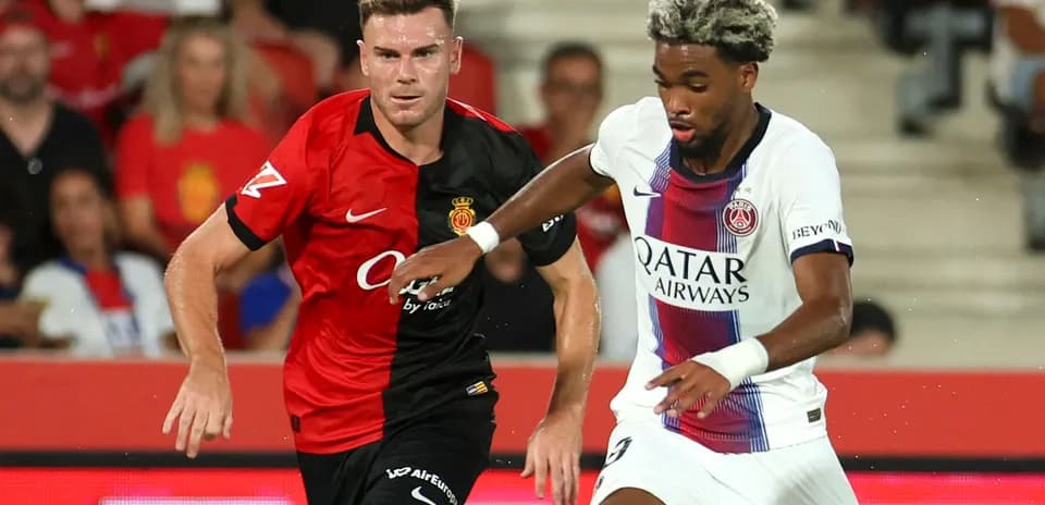 Two players competing for the ball in match