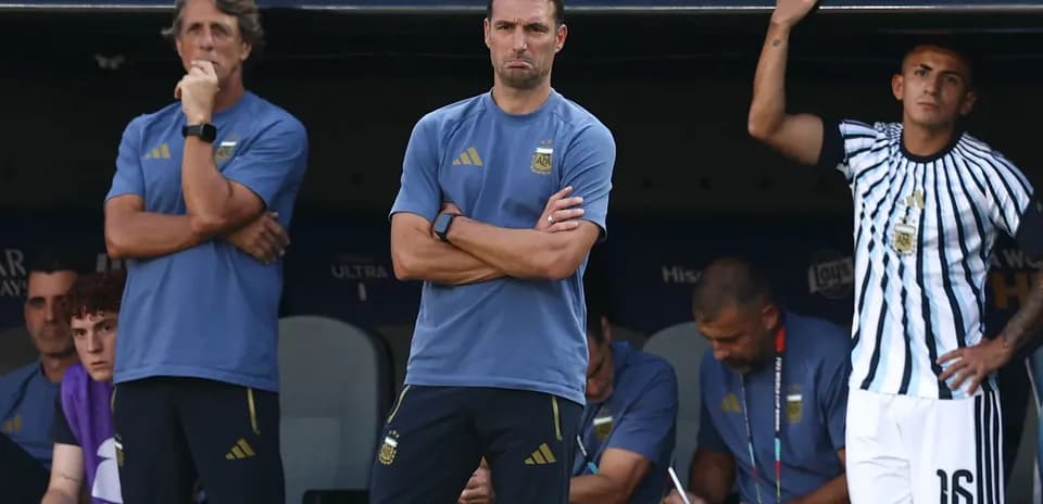 Coaching staff observing the match from bench