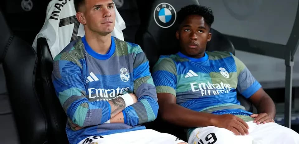 Real Madrid players sitting on the bench during match