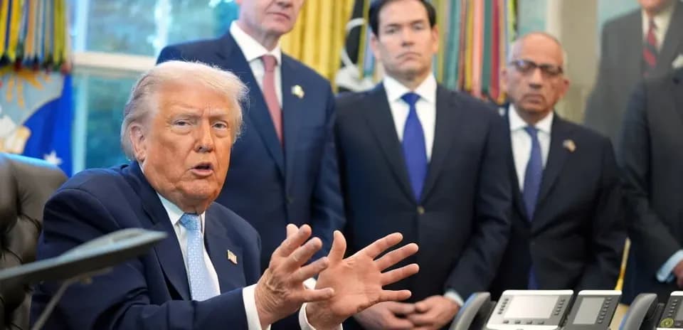 Donald Trump speaking with officials in Oval Office