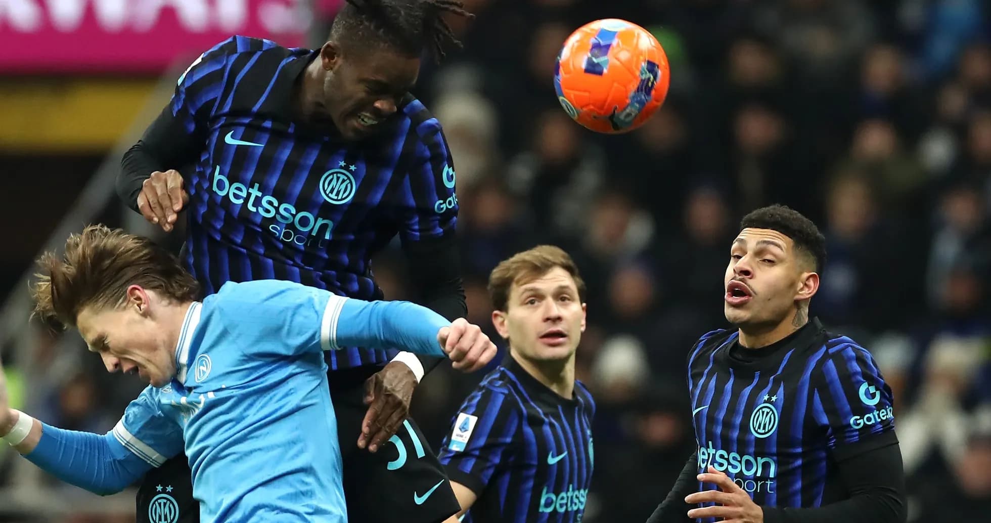Inter Milan player heading ball over opponent