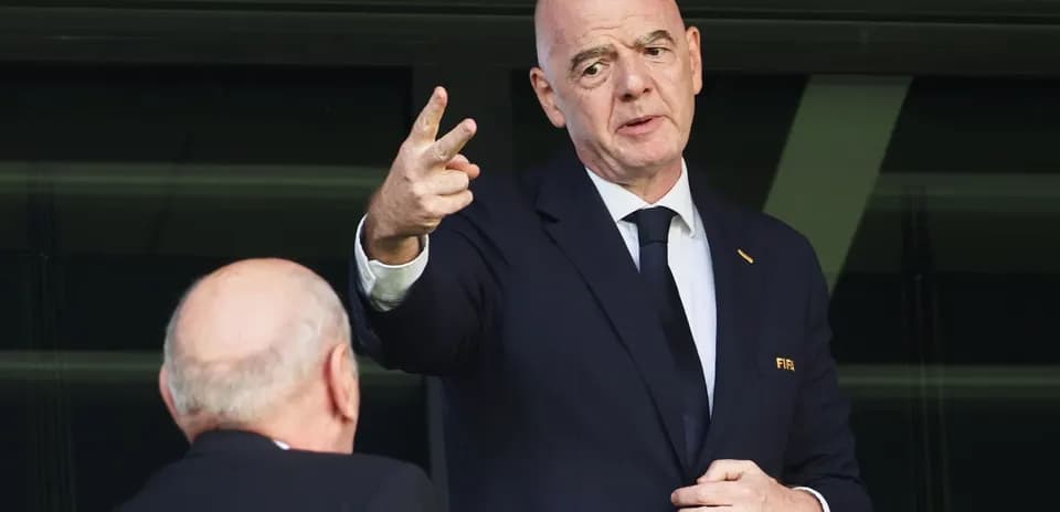 FIFA official speaking during event in stadium