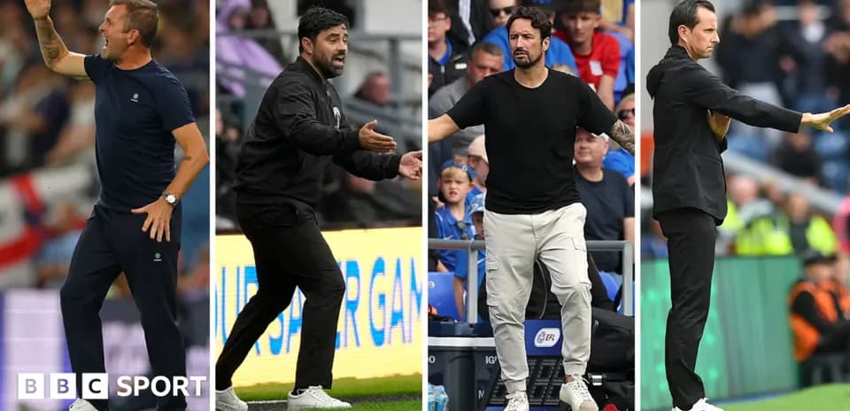 Four football managers gesturing on the sidelines