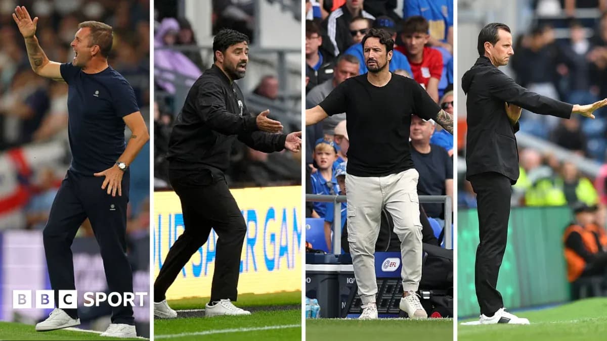 Four football managers gesturing on the sidelines