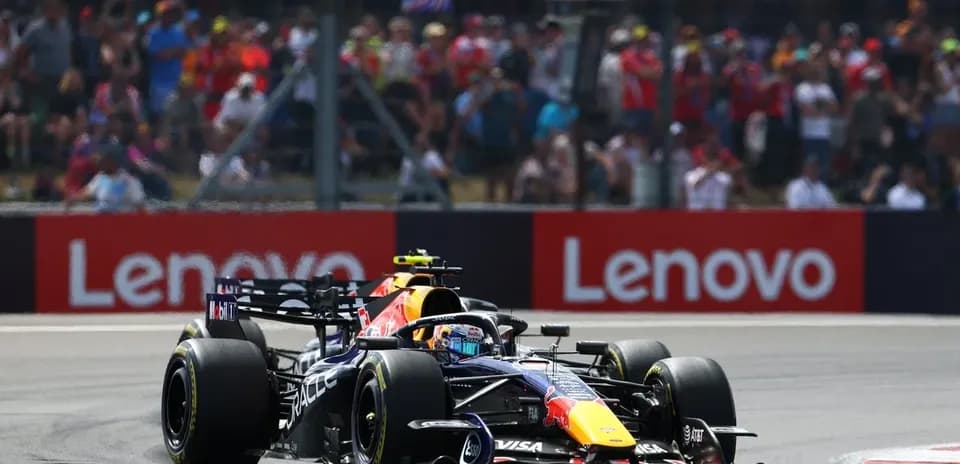 Formula 1 car racing during a sunny event