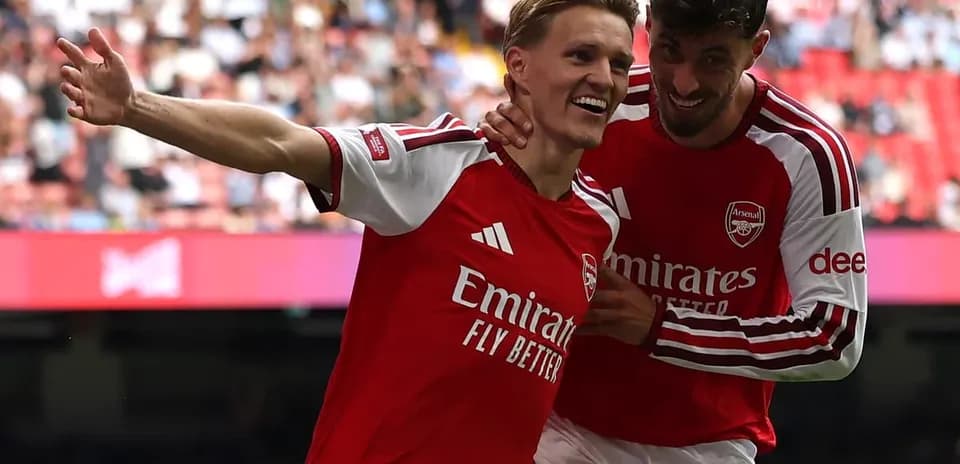Arsenal players celebrating a goal together