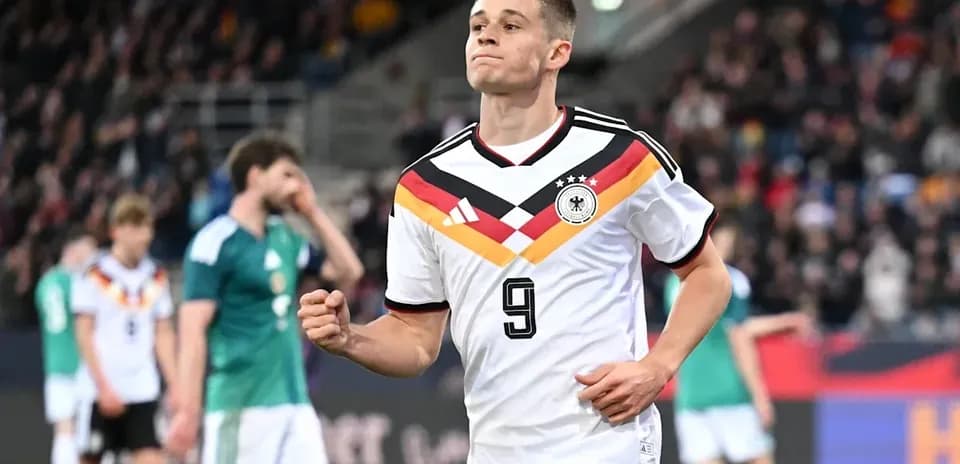 German player celebrating during a football match