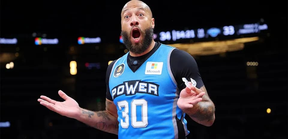 Basketball player in blue jersey reacting during game
