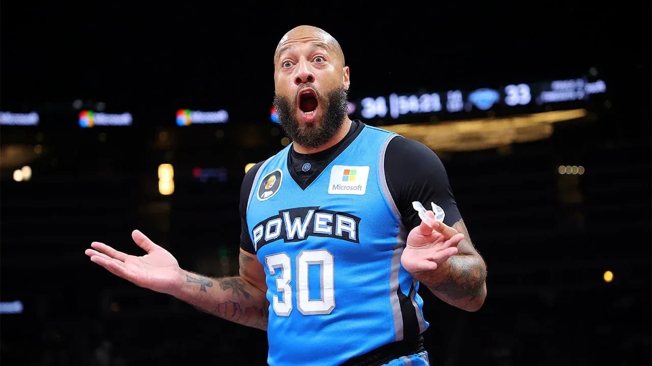 Basketball player in blue jersey reacting during game