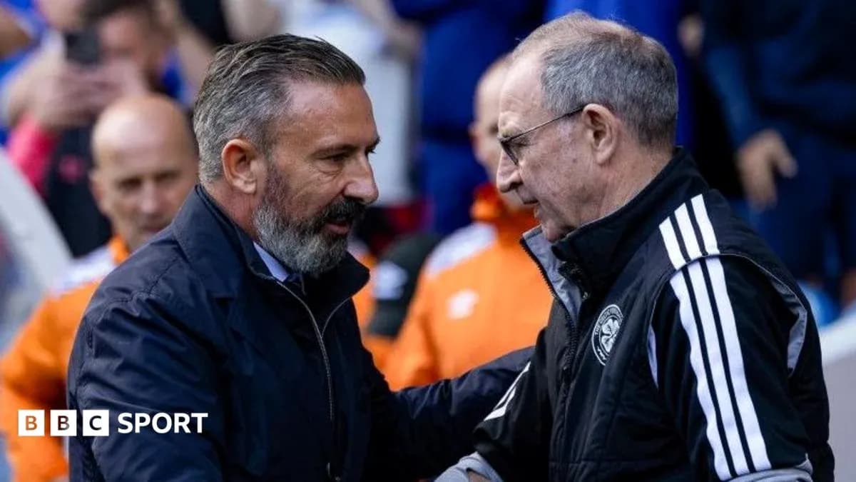 Two coaches shaking hands before the match