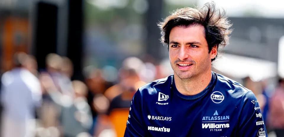 Formula 1 driver walking in team uniform