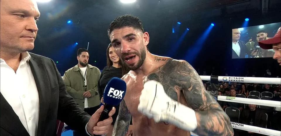 Boxer speaking into microphone after match