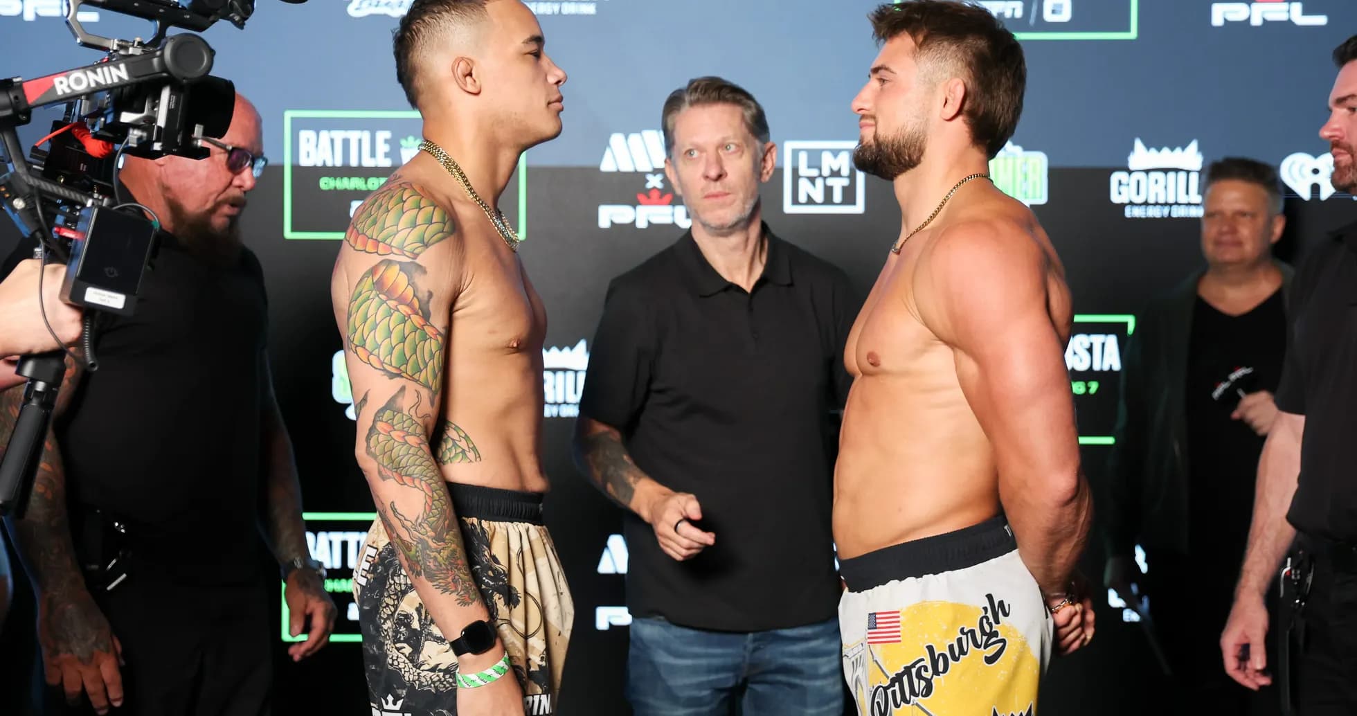 Two fighters facing off at weigh-in event