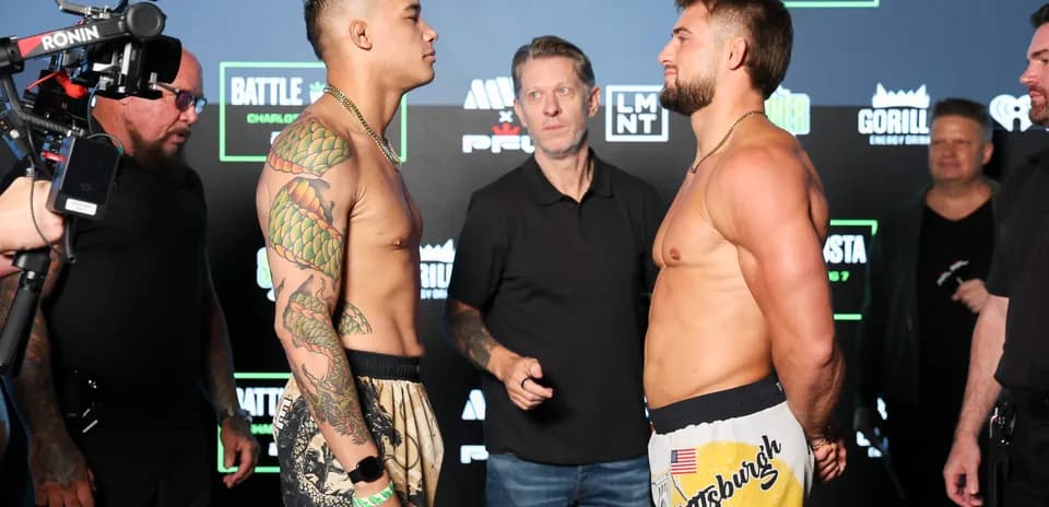 Two fighters facing off at weigh-in event