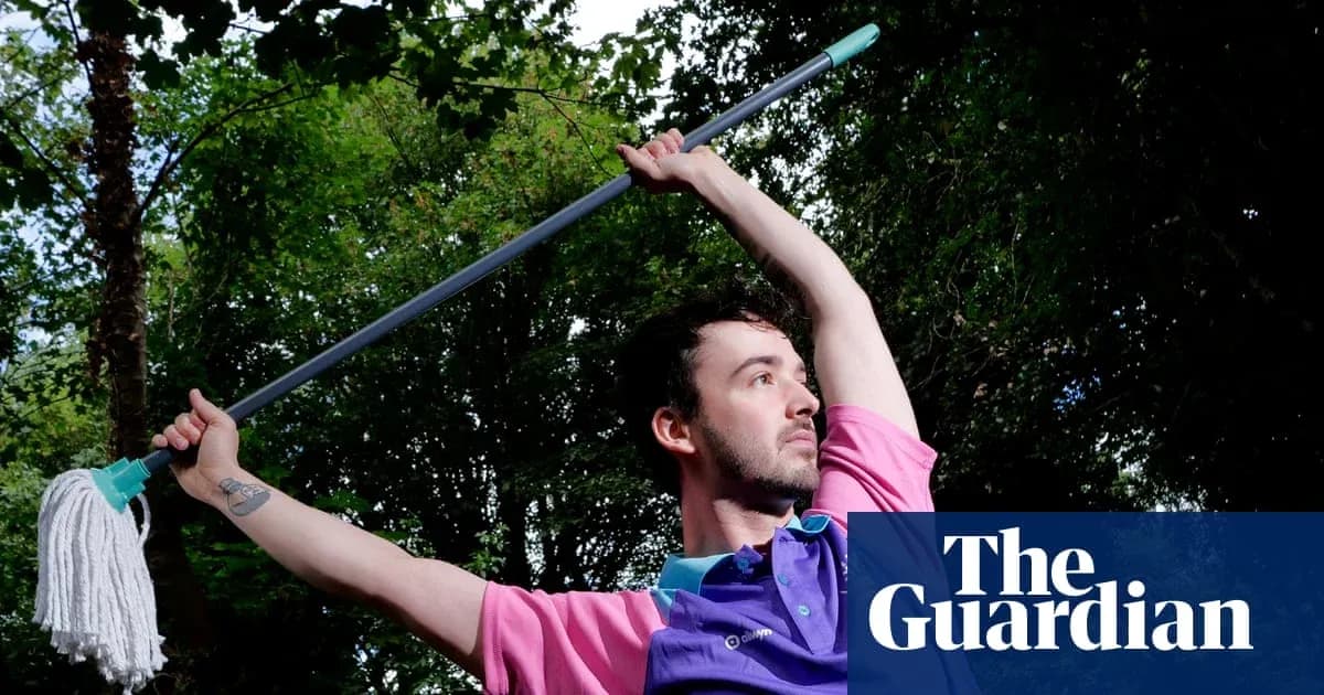 Person holding a mop in a dynamic pose outdoors