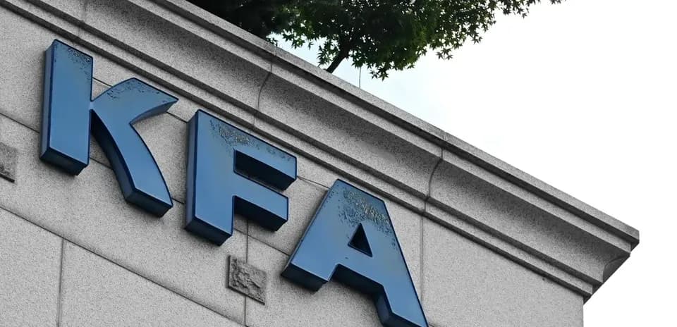 KFA sign on building facade with greenery