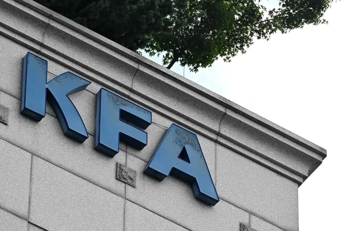 KFA sign on building facade with greenery