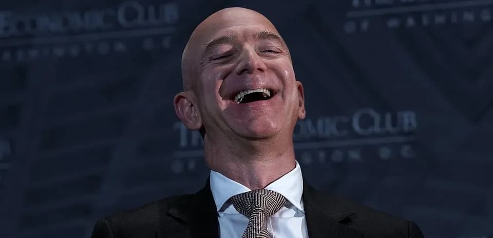 Speaker laughing at Economic Club event