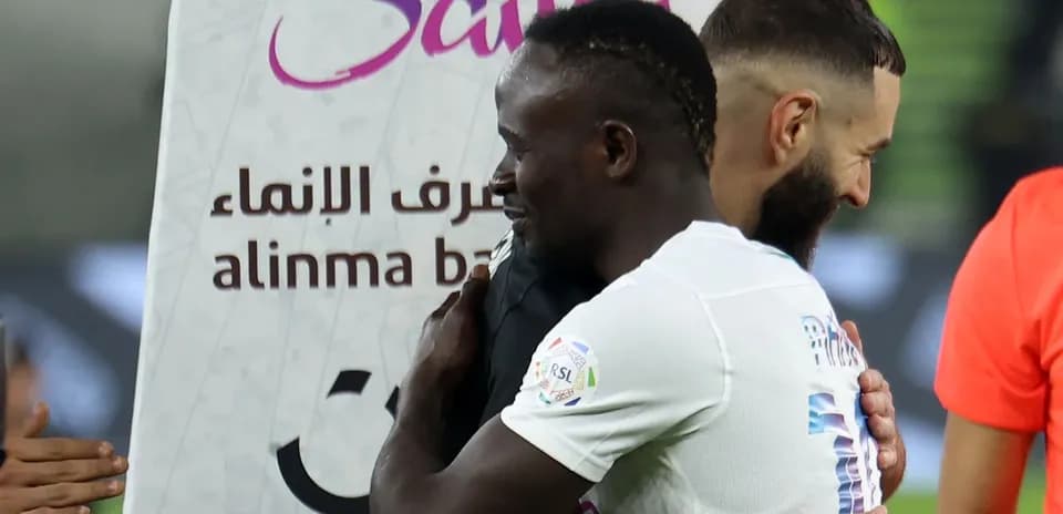 Two players embracing after a match