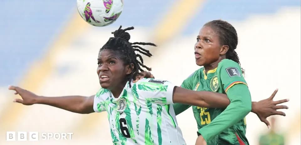 Two players challenging for the ball in match