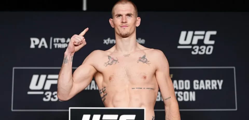 UFC 330 weigh-in, fighter posing with raised finger