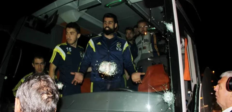 Fenerbahçe players on team bus with bullet holes