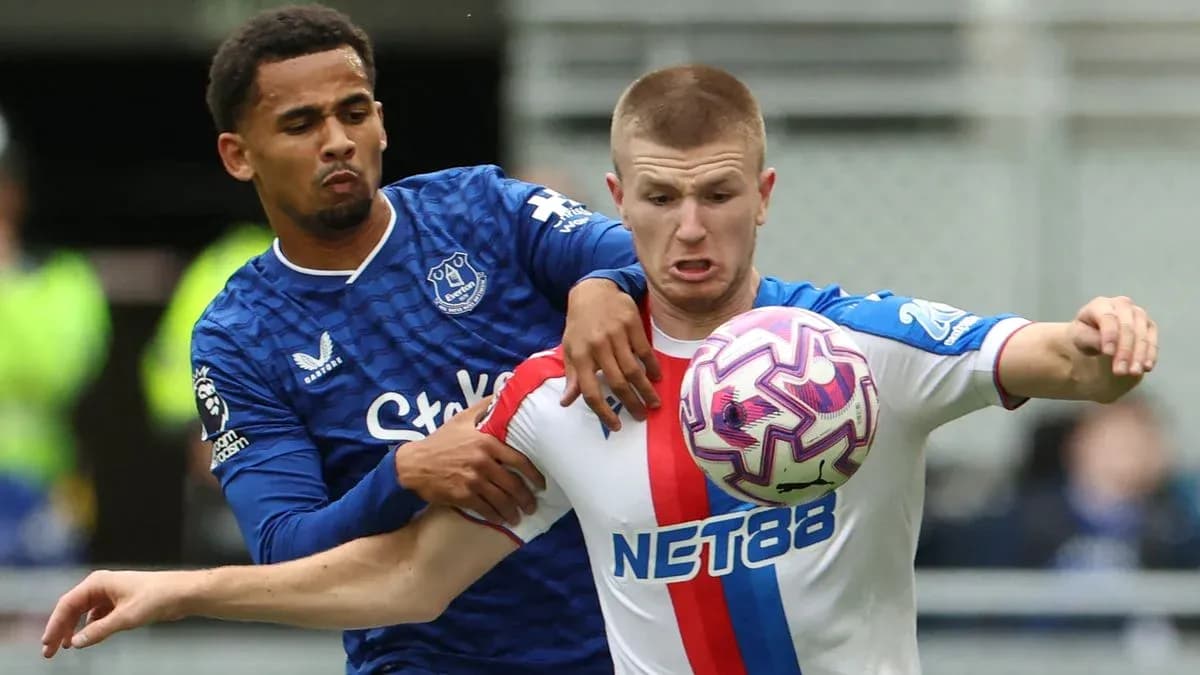 Two players contesting for the ball during match