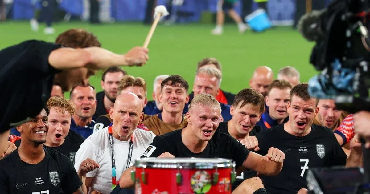 Team celebrating with a drum after match victory