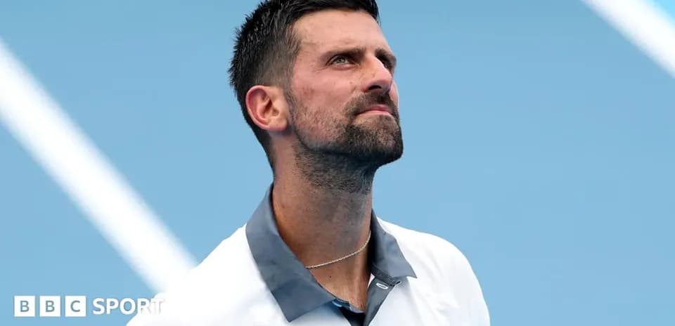 Tennis player looking up during match