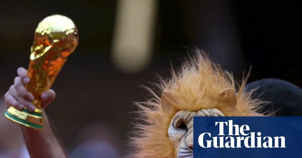 Fan in lion costume holding World Cup trophy