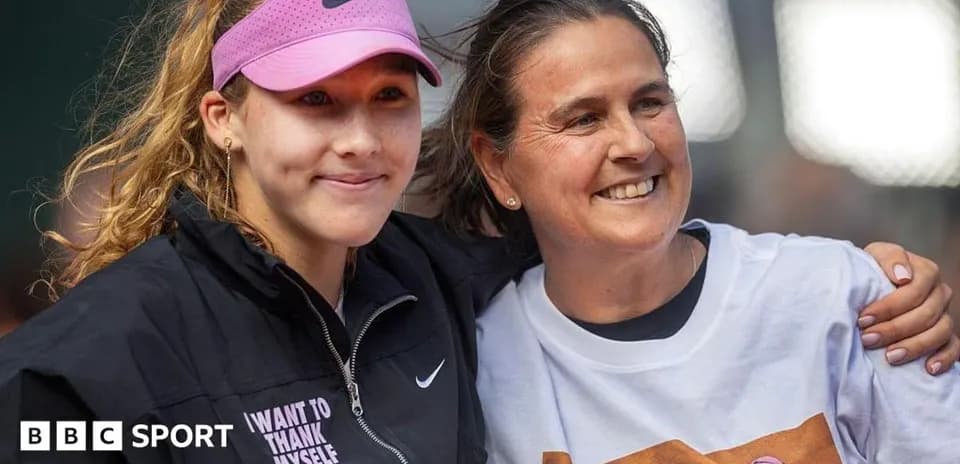 Tennis player and coach posing together after match