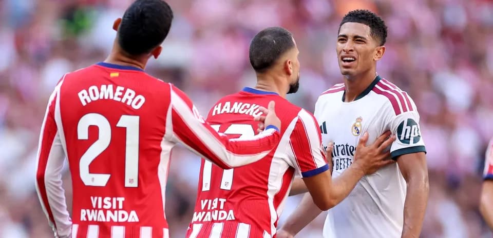 Atletico Madrid players confronting Real Madrid opponent