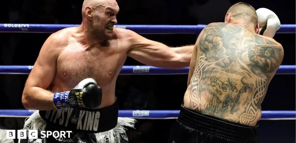 Tyson Fury throwing a punch during boxing match