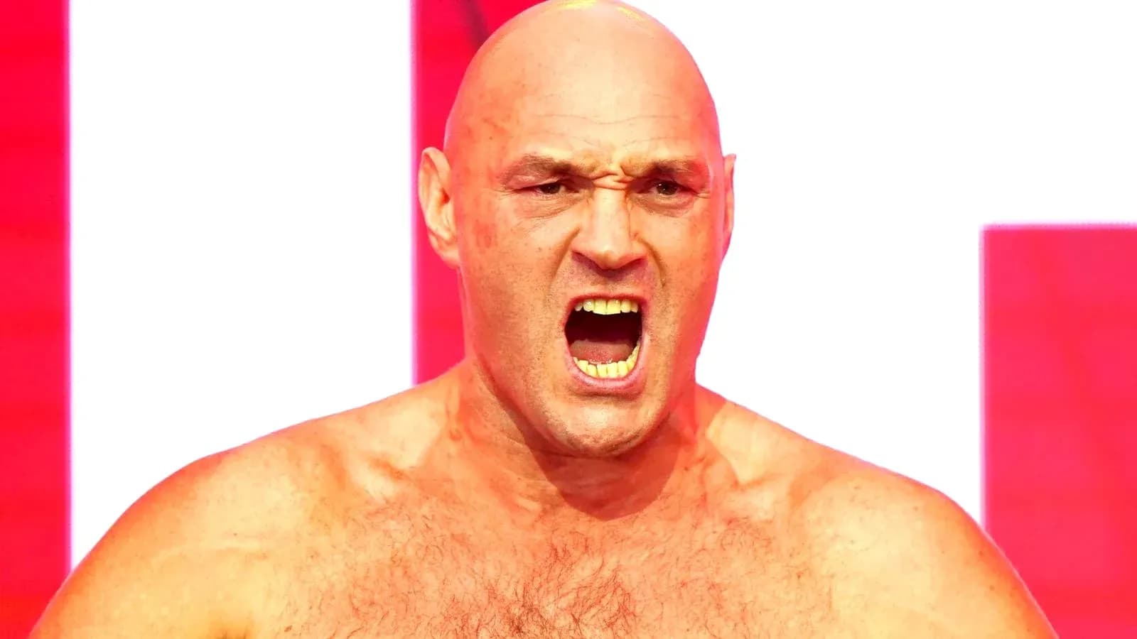 Bald man yelling with intense expression on stage