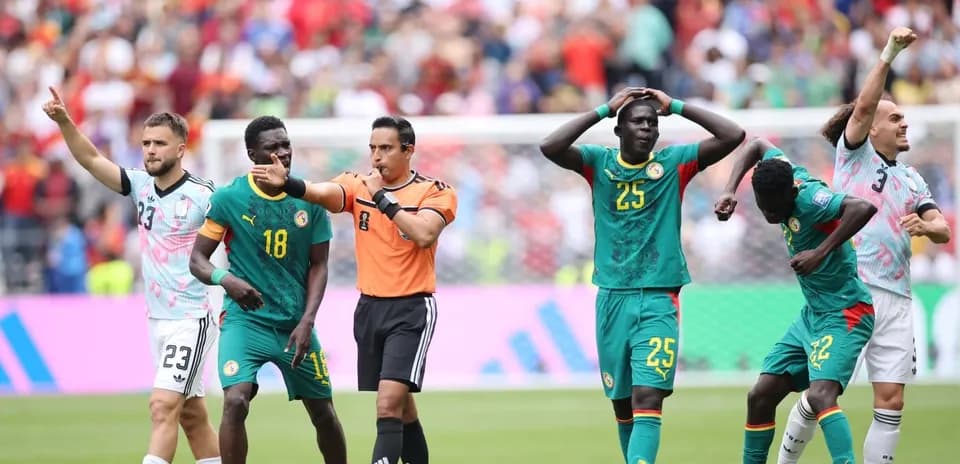 Referee issuing a decision during a match with players