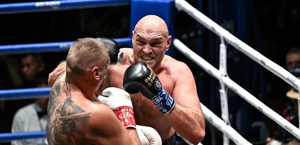 Boxers exchanging punches in the ring
