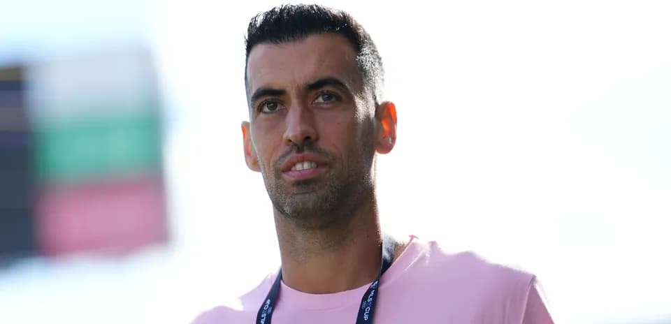 Football player in pink shirt during match day