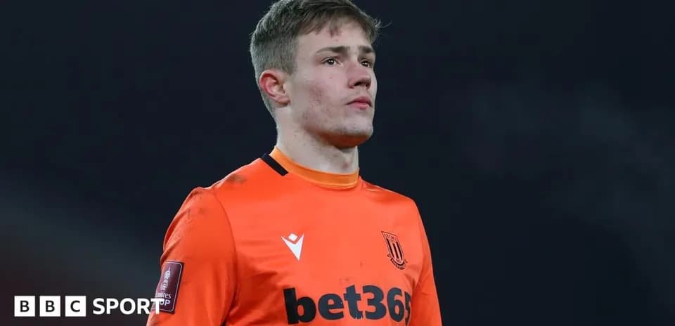 Stoke City goalkeeper in orange kit during match