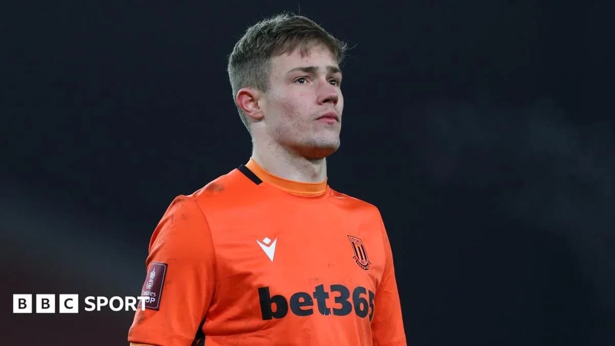 Stoke City goalkeeper in orange kit during match