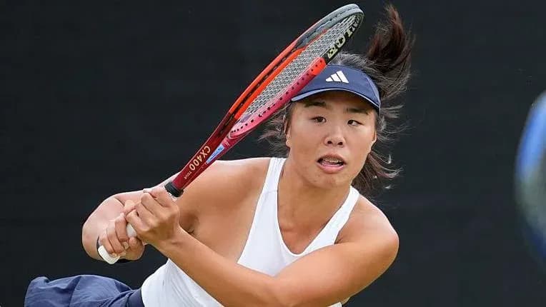 Tennis player hitting a backhand shot